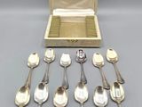 a lot of spoons and spoon spoons in a box