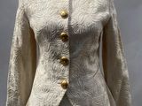 a close up of a white jacket on a mannequin mannequin