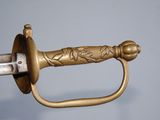 a close up of a sword with a handle on it