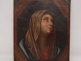 une peinture à l'huile représentant une femme portant un voile sur la tête