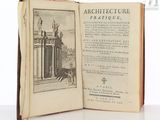 an open book with a picture of a statue on top of it