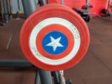 a captain america shield in the middle of a gym