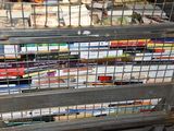a metal cage with books on top of it