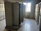 many lockers in the hallway of an empty building