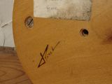 a close up of a wooden table with a label on it