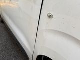 a picture of a white truck parked on the side of the road