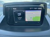 the dashboard of a car with a gps device in the middle of it