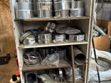 many pots and pans on a shelf in a room