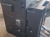 the printer is sitting on top of the cart in the warehouse