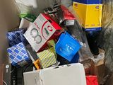 a cardboard box full of electronic devices and other items