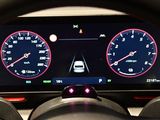 a car dashboard with a steering wheel and gauges on it