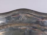 a large silver tray with a design on it