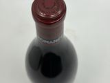 a bottle of wine that is sitting on a table