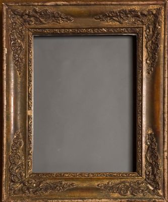 an old gold frame with a decorative pattern on it