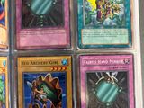 several cards are in a plastic case on a table