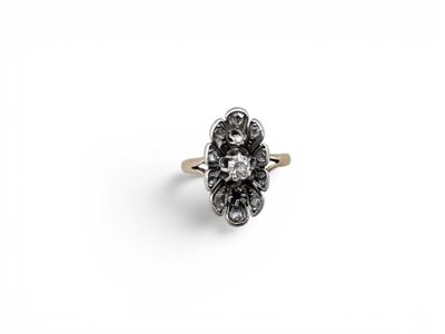 an antique diamond cluster ring with black and white diamonds