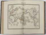 an open book with a map of the world on it