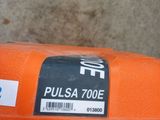 a close up of an orange box with a sticker on it