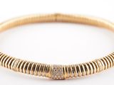 a gold and diamond bracelet
