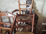 several chairs and a table in a room