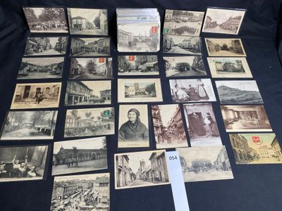 an old photo of a bunch of old postcards on a table