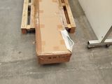 a large box sitting on a pallet in the middle of a room