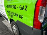 a green and white van parked on the side of the road