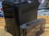 a computer sitting on top of a wooden table