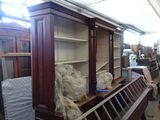 a lot of furniture in a room with a lot of shelves
