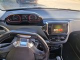a car dashboard with a steering wheel and a dash board