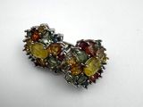 a close up of a ring with multi colored stones on it