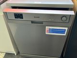 silver dishwasher in a kitchen next to a black refrigerator