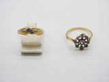 two gold rings and a diamond ring