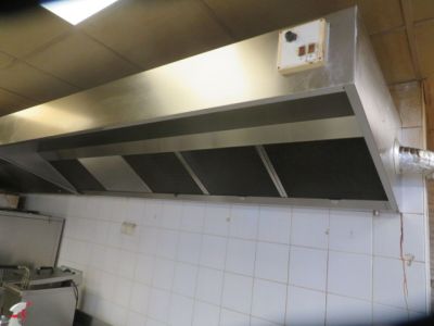 an image of a kitchen with a stove and a range hood
