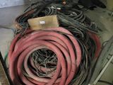 a pile of hoses sitting on the floor in a room