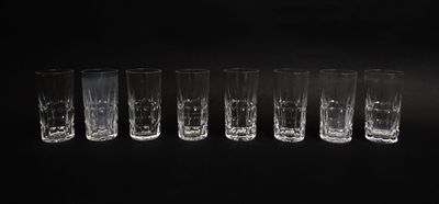 six shot glasses are lined up in a row on a black background