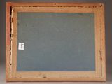 an old picture frame with a small piece of paper in it