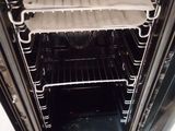 an open oven door with a tray of food inside of it