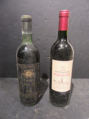 two bottles of wine sitting next to each other on a table