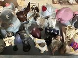 many figurines of animals on a table in a room