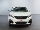the front view of a white car in a white room