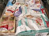 a pile of dog food sitting on top of a luggage bag