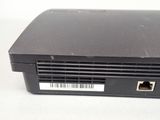 a close up of a black laptop with a barcode on it