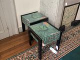 two tables that are sitting in front of a fireplace