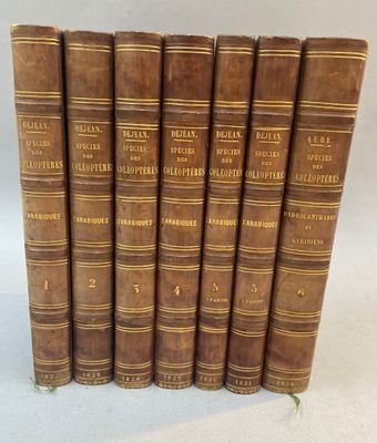 a set of five old books sitting on top of each other