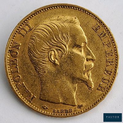 une image montrant un gros plan d'une pièce d'or sur laquelle figure le visage d'un homme