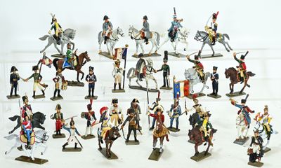a lot of figurines that are on a white surface