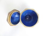 pair of blue glass vases with gold rims on a white surface