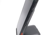 a cell phone that is sitting on top of a stand