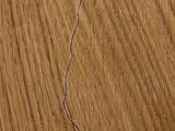 a close up of a piece of wood with a crack in it